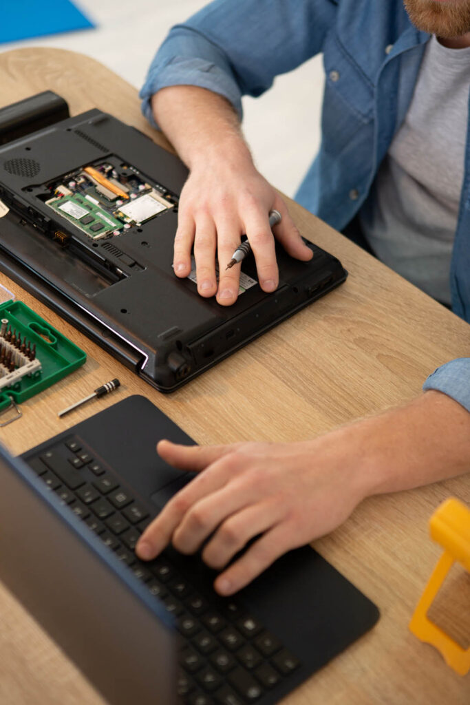 close up of a man examining laptop